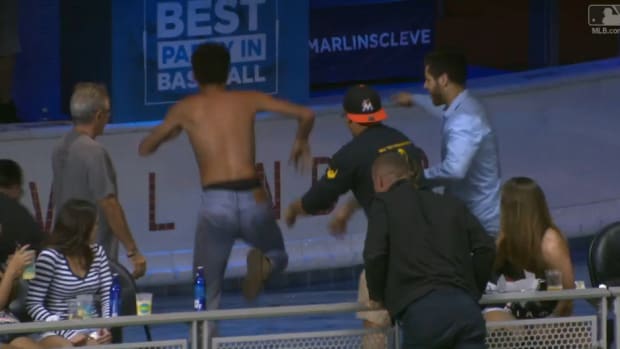 marlins-fan-pool-dive-marcel-ozuna-home-run-video.png